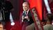 Mark Carney, con traje y micrófono en mano. Mark Carney, con traje y micrófono en mano.
