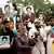 With a hope to highlight cases of enforced disappearances in Bangladesh, relatives and friends of the victims hold photos of missing activists, in Dhaka, Bangladesh, on August 11, 2024