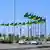 Flags of Saudi Arabia and Ukraine line a street
