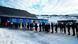 A number of people stand in line to vote in a snowy landscape in front of a polling station in Nuuk, Greenland A number of people stand in line to vote in a snowy landscape in front of a polling station in Nuuk, Greenland