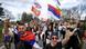 Students and anti-government protesters wearing or carrying flags and banners cheer and blow whistles as they walk along a tree-lined country road on their way to Belgrade, Cortanovci, Serbia, March 13, 2025 Students and anti-government protesters wearing or carrying flags and banners cheer and blow whistles as they walk along a tree-lined country road on their way to Belgrade, Cortanovci, Serbia, March 13, 2025