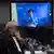 Duterte seen on video screen, with lawyer Medialdea in foreground on Friday, March 14, 2025.
