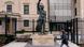 A person walks past the statue of Nelson Mandela outside the South African Embassy in Washington, DC A person walks past the statue of Nelson Mandela outside the South African Embassy in Washington, DC