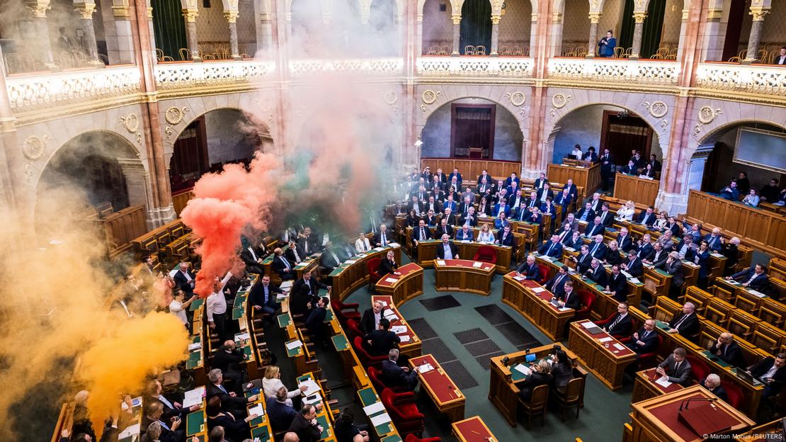 Colored smoke billows in the opulent interior of Hungary's parliament on March 18, 2025 in portest of the LGBTQ legislation