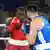 Nelvie Tiafack boxing against Bakhodir Jalolov