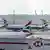 Airplanes remain parked on the tarmac at Heathrow International Airport after a fire at a nearby electrical substation wiped out the power at the airport on March 21, 2025