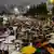 Protesters stand with umbrellas on the streets of Jerusalem