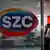 Girişinde Sözcü TV logosunun olduğu bir ofiste Sözcü TV Genel yayın Yönetmeni Özgür Çakmakçı ve bir başka çalışan