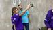 Students pose for a selfie with trainer