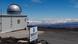 The Mauna Loa Observatory. Clouds and the sea are in the background of the research station and a sign announcing the observatory is in the foreground The Mauna Loa Observatory. Clouds and the sea are in the background of the research station and a sign announcing the observatory is in the foreground