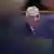 Hungarian Prime Minister Viktor Orban looks on, surrounded by a black frame in soft focus