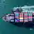 A container ship sails as it approaches a port in Qingdao, in eastern China's Shandong province on April 2, 2025