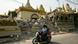 People ride a scooter past the rubble of damaged Buddhist pagoda in Mandalay People ride a scooter past the rubble of damaged Buddhist pagoda in Mandalay