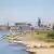 A view of Cologne and the Rhine River, at a very low level, the dry sandy river bottom exposed