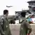 Indian Air Force personnel looks on as a US F-15 jet takes off during the joint exercise Cope India 2023