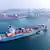 Shipping container ship sails off