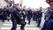 Hungarian police officers carry away a protestor with many other police officers standing around Hungarian police officers carry away a protestor with many other police officers standing around