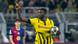 Borussia Dortmund's Serhou Guirassy holds a football in his left hand and points his right index finger to the sky Borussia Dortmund's Serhou Guirassy holds a football in his left hand and points his right index finger to the sky