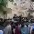 Police officers arrive to the scene as supporters of Tehreek-e-Labbaik Pakistan or TLP party crowd the street in Karachi, Pakistan, April 18, 2025