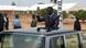 Traveling in a limousine, Faure Gnassingbe waves to supporters