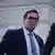 George Santos, seen here wearing suit and tie 