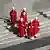 A small group of cardinals in traditional red robes walking down stairs in St. Peter's Square