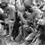 U.S. infantrymen pray in the Vietnamese jungle, looking down or covering their faces with their hands, 1965