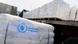 Caminhões com sacas de alimentos do Programa Alimentar Mundial da ONU