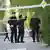 Police officers investigae in the aftermath of the shooting.