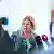 Nancy Faeser ante varios micrófonos.