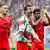 Die Spieler Kimmich, Müller und Coman animieren die Bayern-Fans im Leipziger Stadion