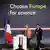 Emmanuel Macron and EU's Ursula Von der Leyen smile while walking to the podium with 'Choose Europe for Science' slogan behind them