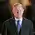 Olaf Scholz is seen wearing a suit and tie, looking into the camera, on May 5, 2025