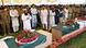 Imams and officials stand above caskets draped in Pakistani flags Imams and officials stand above caskets draped in Pakistani flags