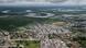 Aerial view of Iquitos in Peru, showing buildings and in the distance a wide, long river and jungle Aerial view of Iquitos in Peru, showing buildings and in the distance a wide, long river and jungle