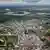 Aerial view of Iquitos in Peru, showing buildings and in the distance a wide, long river and jungle