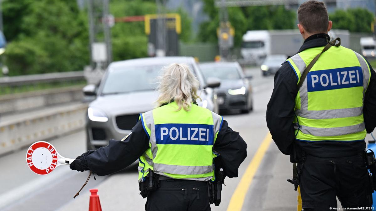 German police carrying out a border control spot check at a border with Austria in 2025