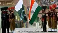 Indian, in khaki, and Pakistani soldier, in black, lower their respective national flags during a ceremony at the India-Pakistan joint border check post, Wagah, India
Indian, in khaki, and Pakistani soldier, in black, lower their respective national flags during a ceremony at the India-Pakistan joint border check post, Wagah, India