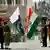 Indian and Pakistani flags at ceremony at the Wagah border post in 2003