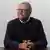 Bill Gates sits for a photo after an interview with The Associated Press, a slight smile on his face