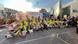 A group of students wearing yellow hi-vis vests hold up medals around their neck as they sit for a group photo in front of a sign that reads 'running for democracy, dignity and future' outside the EEAS building in Brussels, Belgium, May 13, 2025 A group of students wearing yellow hi-vis vests hold up medals around their neck as they sit for a group photo in front of a sign that reads 'running for democracy, dignity and future' outside the EEAS building in Brussels, Belgium, May 13, 2025