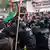 Large numbers of protesters and police at a demonstration in Berlin