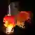 A Long March 3B rocket blasts off a launch pad at night.