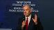 Benjamin Netanyahu giving a speech with a sign in the background reading State of Israel Prime Minister's Office in Hebrew and English Benjamin Netanyahu giving a speech with a sign in the background reading State of Israel Prime Minister's Office in Hebrew and English