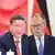 Porträtbilder von Chinas Präsident Xi Jinping und Deutschlands Bundeskanzler Friedrich Merz