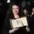 Mascha Schilinski holding the Jury Prize award at the Cannes Film Festival.