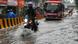 Traffic moving through a waterlogged road in Mumbai Traffic moving through a waterlogged road in Mumbai