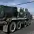 Cambodian soldiers sit atop a BM-21 Grad self-propelled multiple rocket launcher in Phnom Penh