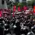 Demonstrators carrying Nepal's national flag take part in a pro-monarchy rally in Kathmandu on May 29, 2025