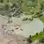 An aerial photo shows a flooded mountain village